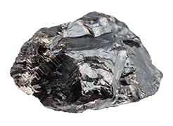 A dark gray, metallic-looking mineral rests on a plain white background. Its rough, crystalline structure is prominently displayed.